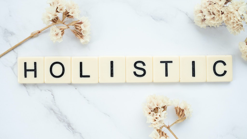 holistic word made using scrabble pieces of letter